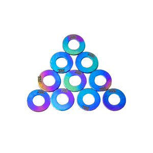 Iridescent washers stacked in a pyramid formation on a white background