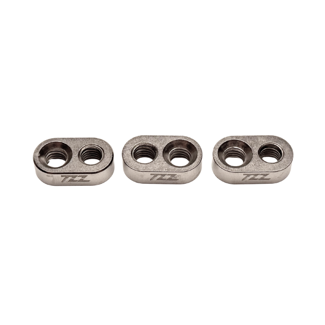 Three metallic components with 'TZZ' branding on a white background