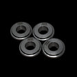 Four metallic rings with 'TZZ' branding on a black background