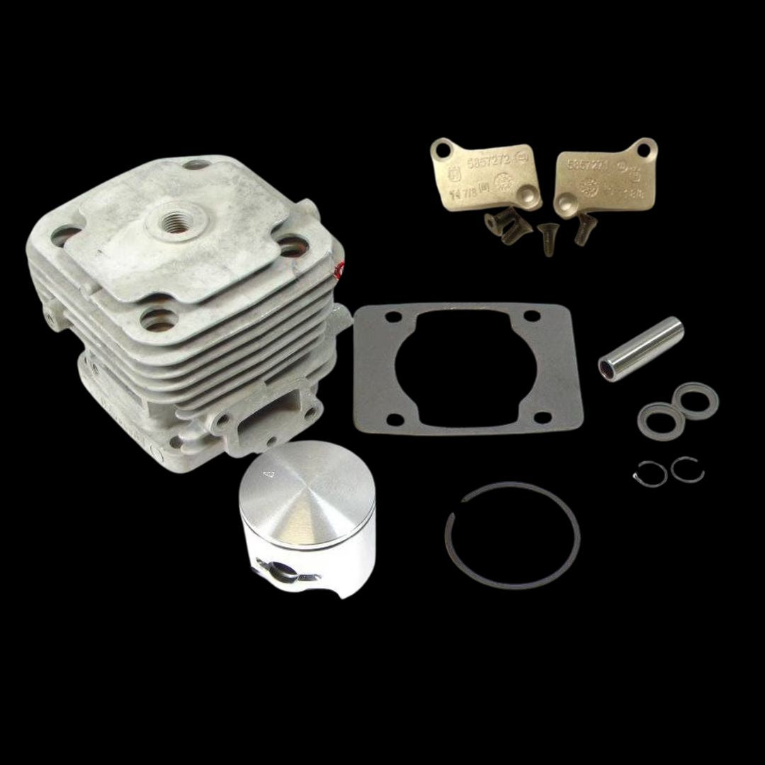 A collection of engine parts including a cylinder, piston, ring, gasket, and other components for a Zenoah G320RC racing kart engine.